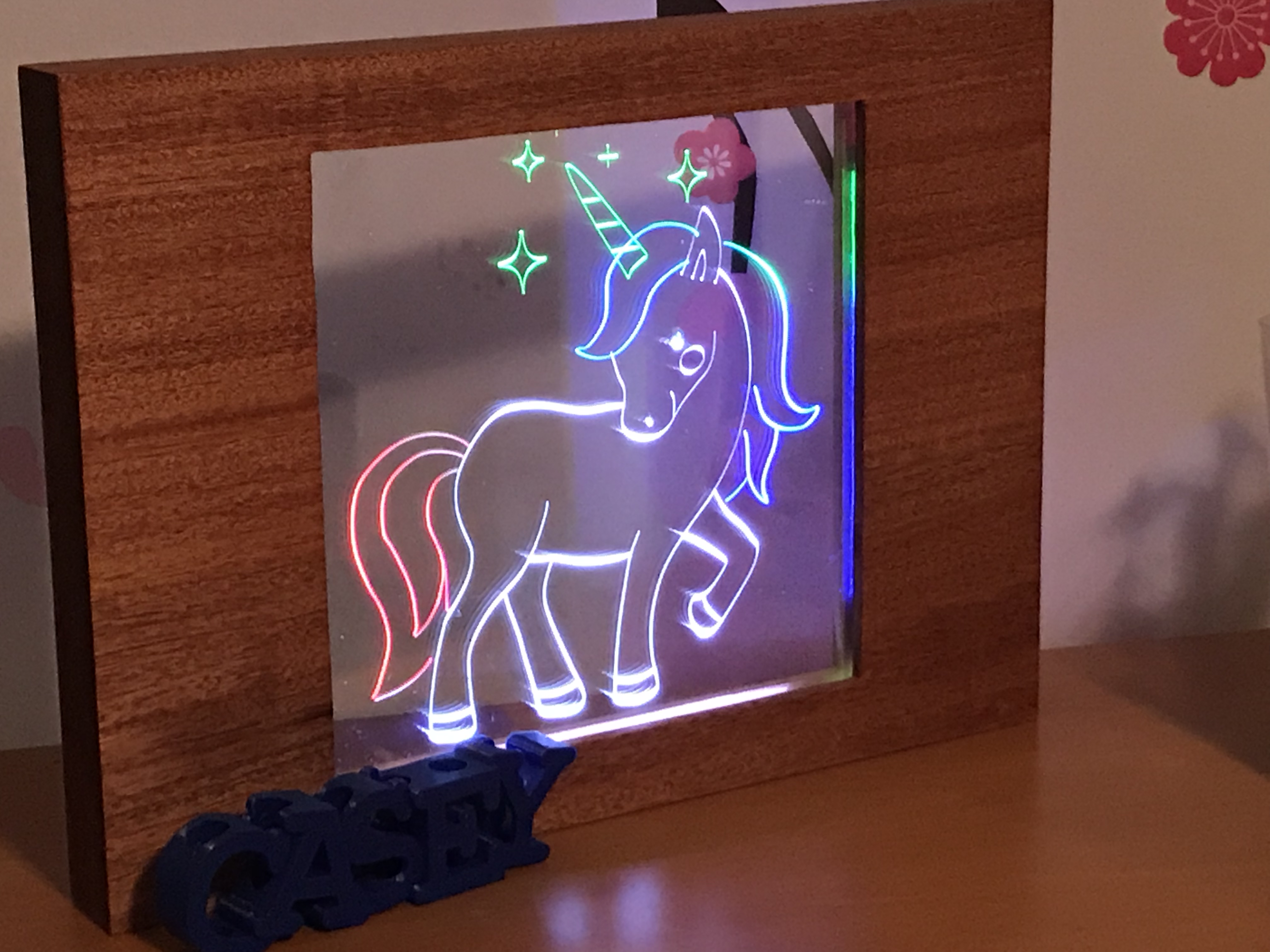 The full unicorn frame and acrylic, assembled and lit